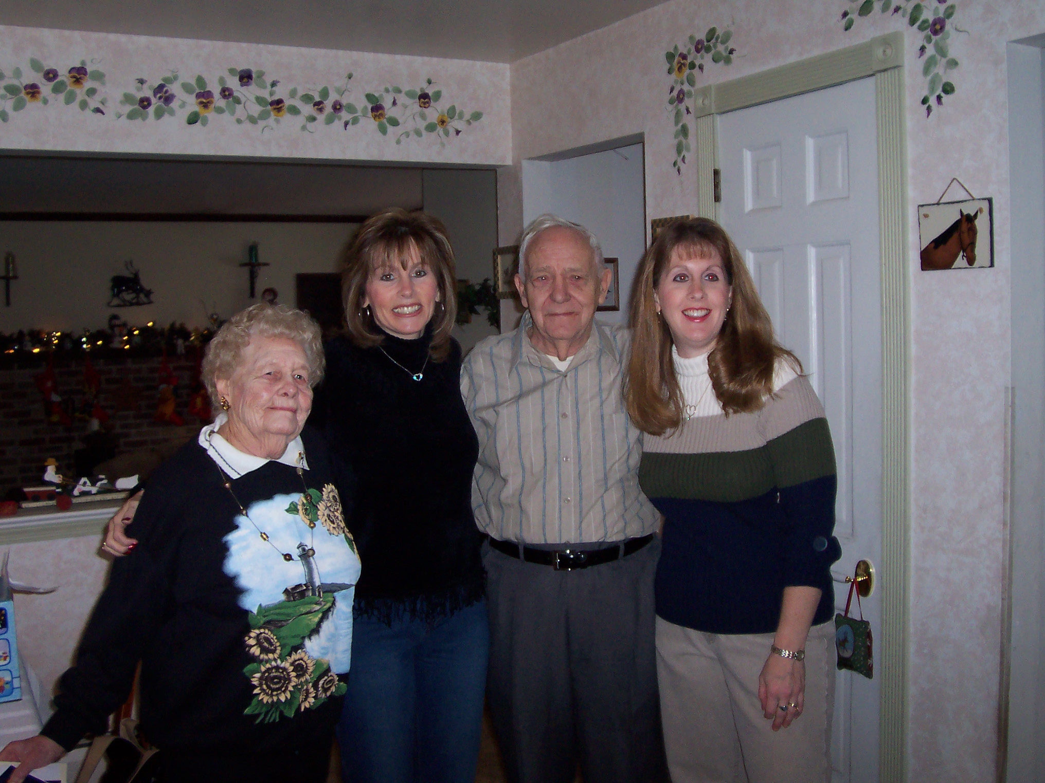 Virginia & Charles with Grandchildren Marilyn(left) and Lorie(right) Christmas 2003